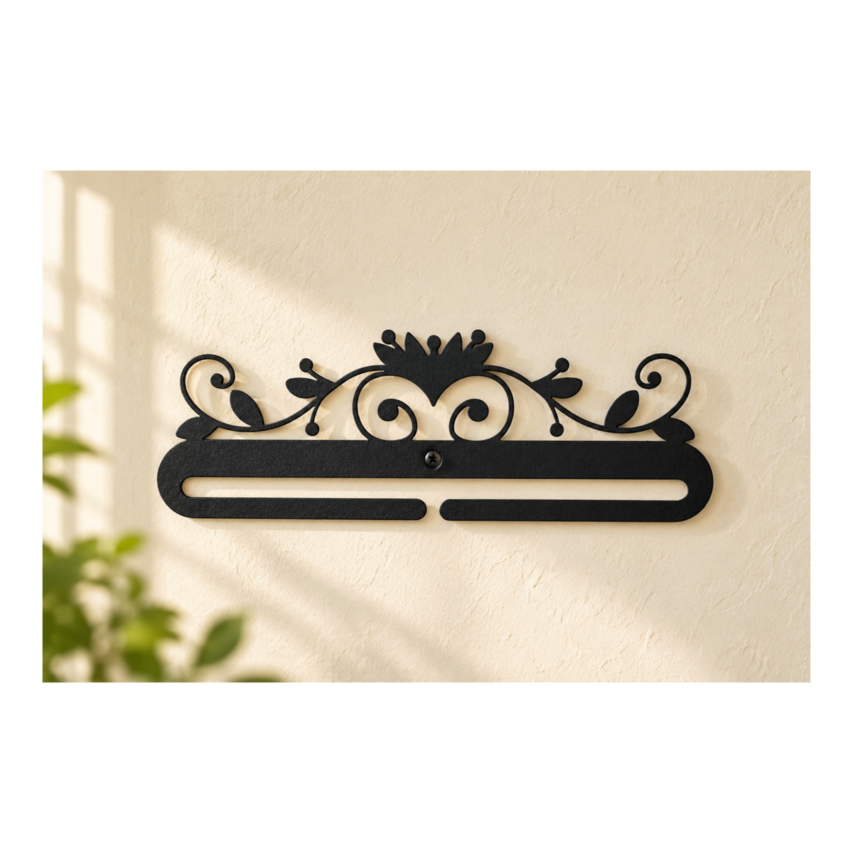 Black 12 inch Lotus quilt hanger displayed on a warm ivory wall
