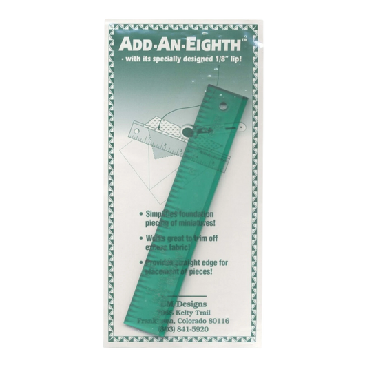 Everything Fabric Add-an-Eighth 1x6 inch green acrylic quilting ruler with a raised lip for seam allowances.