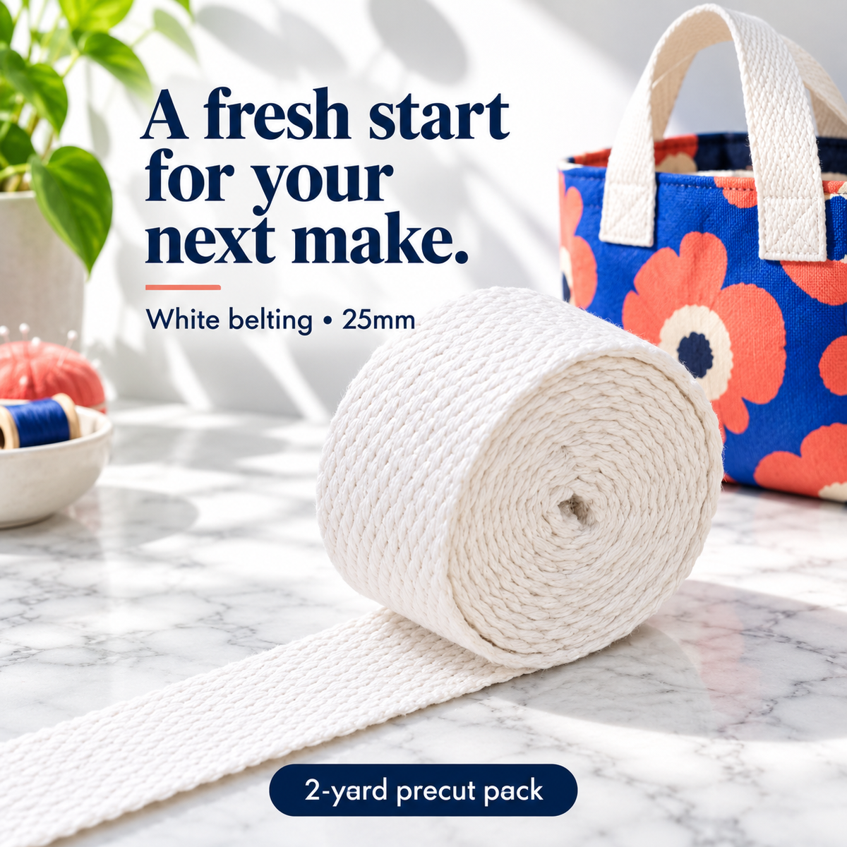 White 25mm woven belting in a two-yard precut pack, with a bright modern fabric-bag styling example.